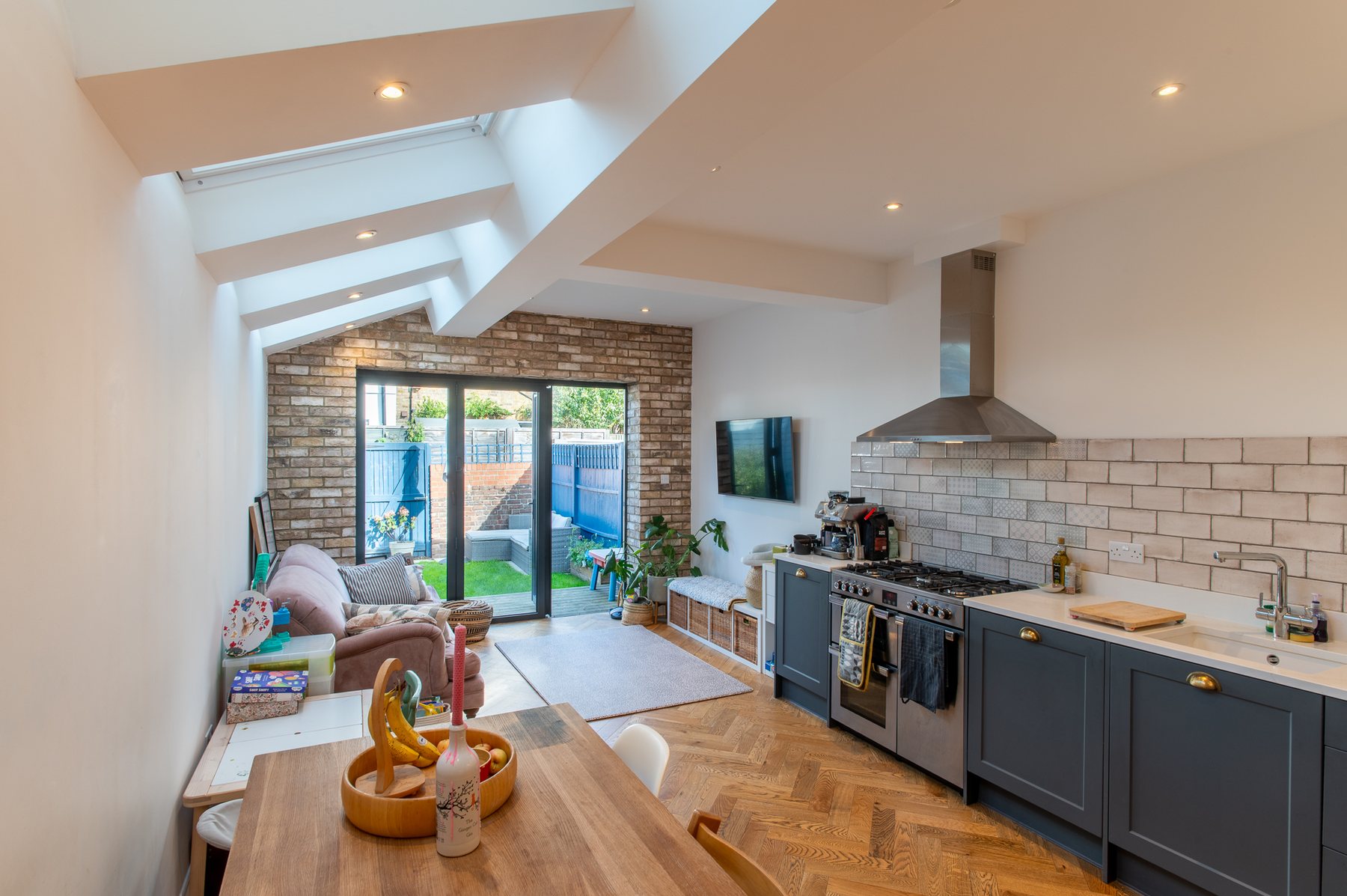 Kitchen diner with roof lantern and exposed brick